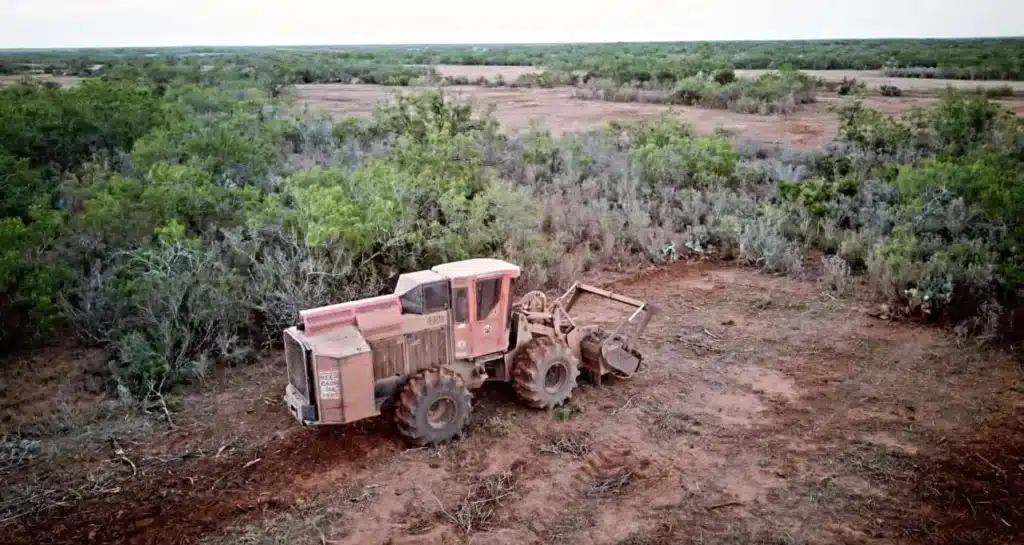 Forestry mulching equipment clearing brush on rural Texas land